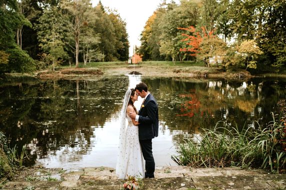 Picture of newly married couple by the lake